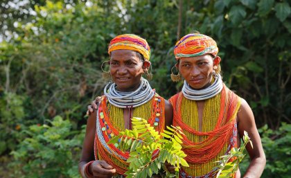 Indigenous villagers in the heavily forested state of Odisha, India. Indigenous villagers in the heavily forested state of Odisha, India, with the forest behind them